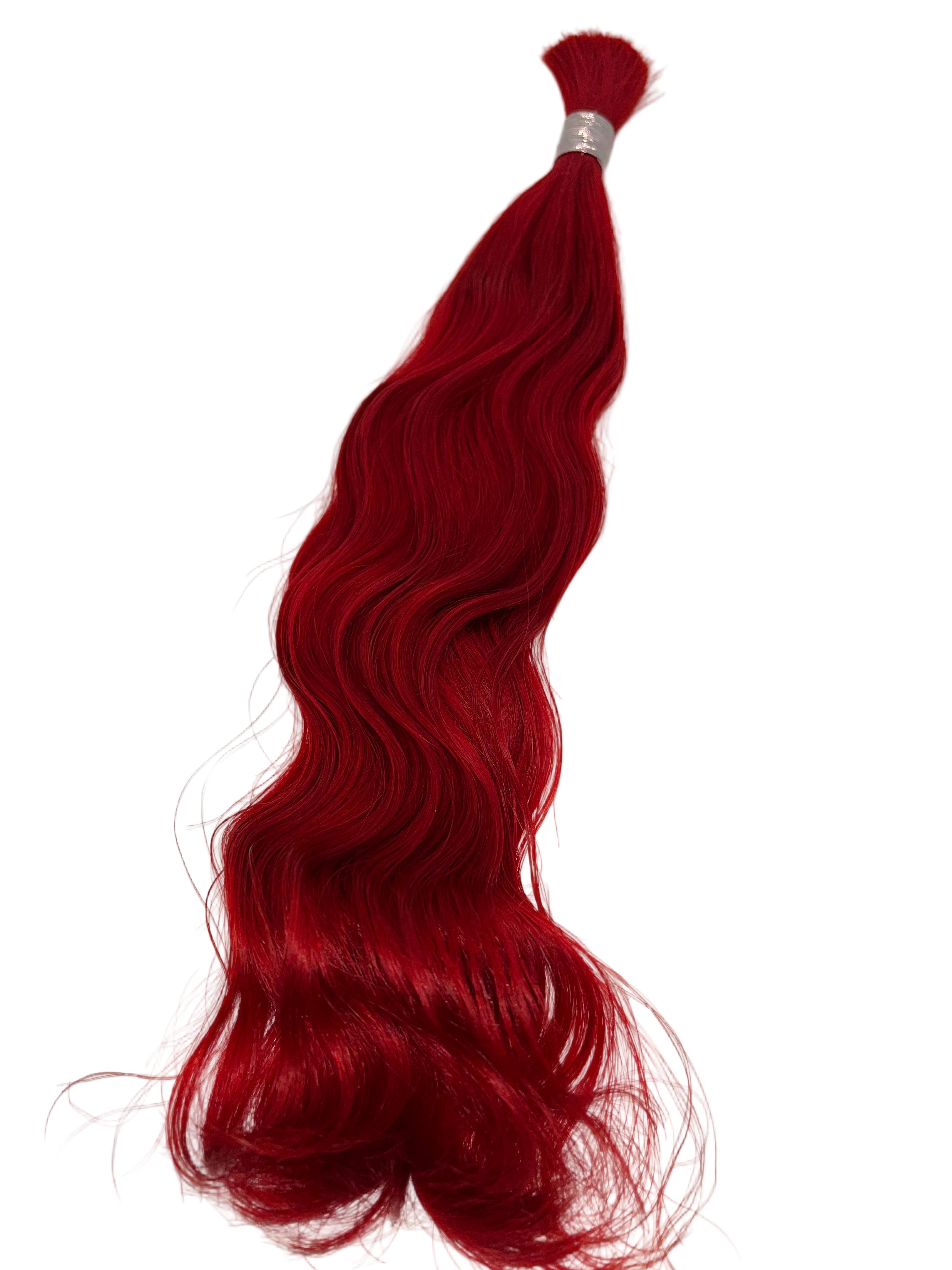 Red hair extensions on a white background
