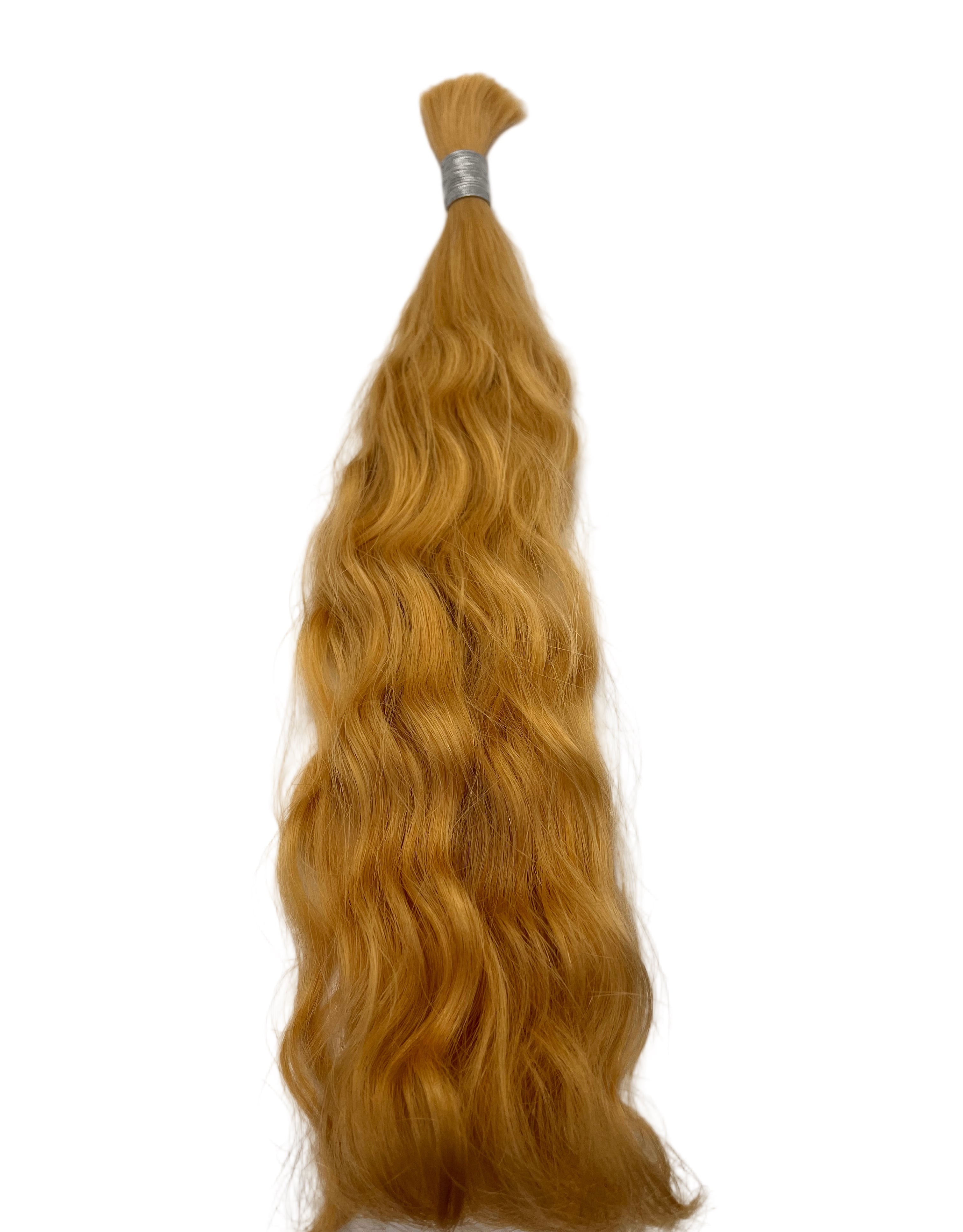 Blonde hair extension on a white background