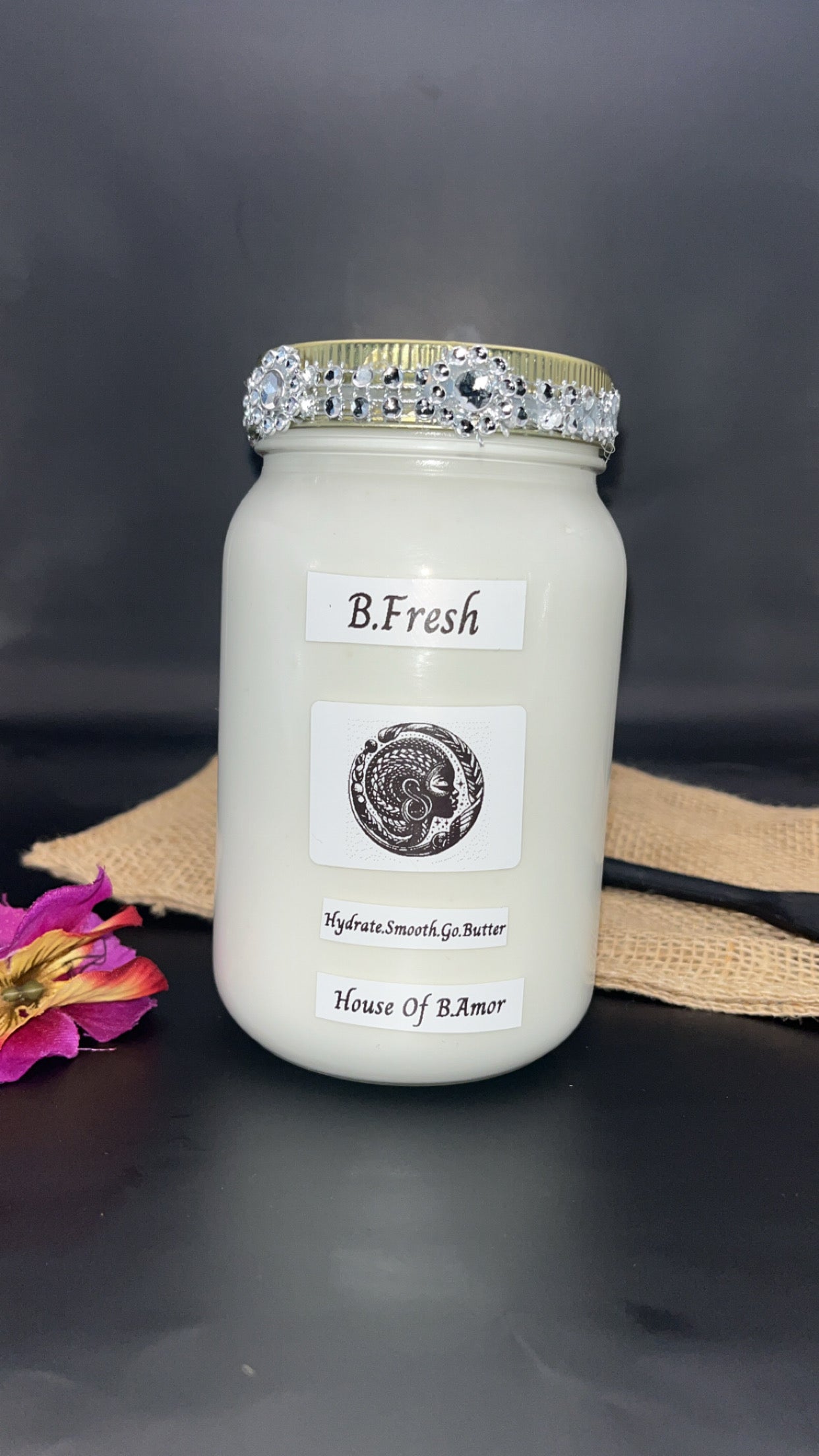 Jar with decorative lid labeled 'B.Fresh' on a dark background