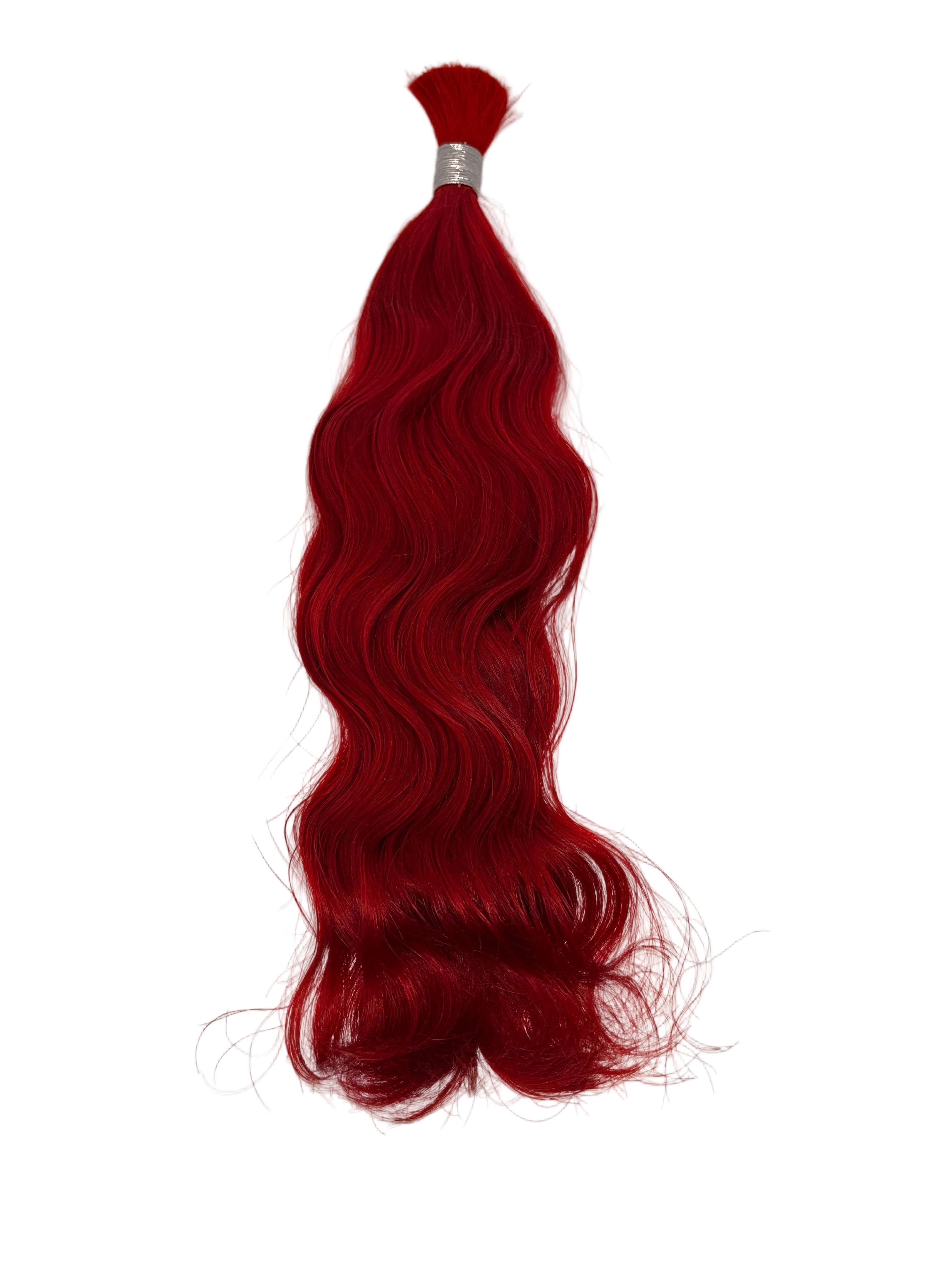 Red hair extensions on a white background